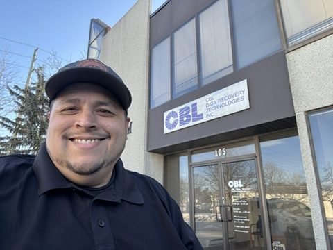 Jose Ponce Jr. outside CBL Data Recovery during a 2026 visit to his former workplace in Canada.