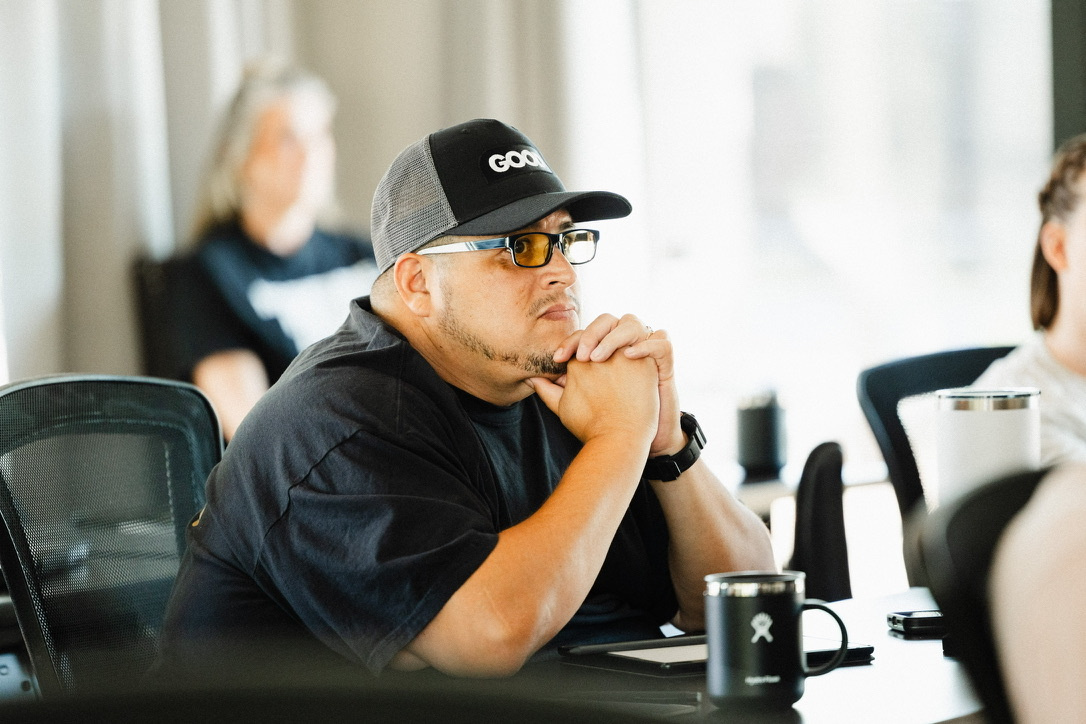 Jose Ponce Jr. listening during a professional workshop.